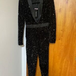 PRETTYLITTLETHING BLACK PLUNGE FRONT SEQUIN JUMPSUIT A